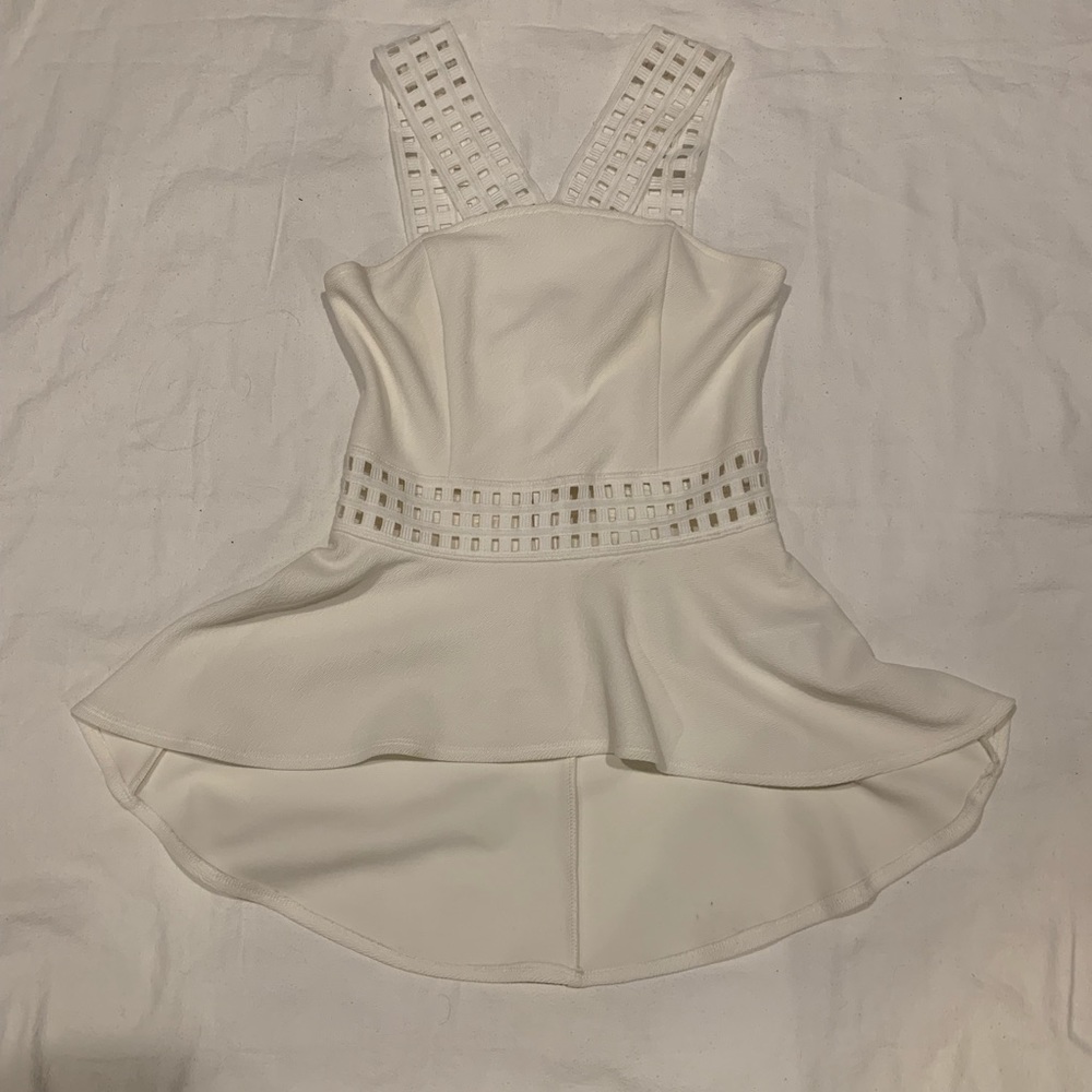 Bebe ivory peplum with lace crisscross neck top XS